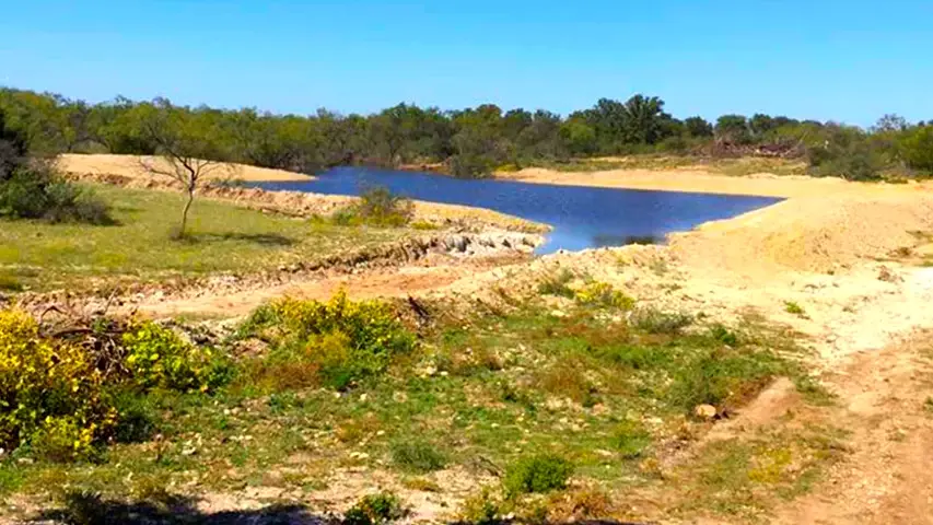 Land clearing stock tank