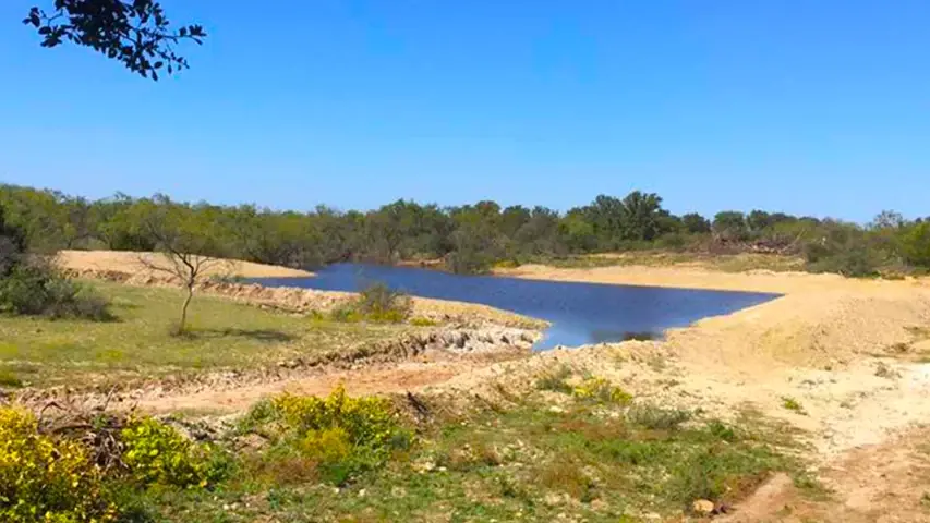 Land clearing stock tank